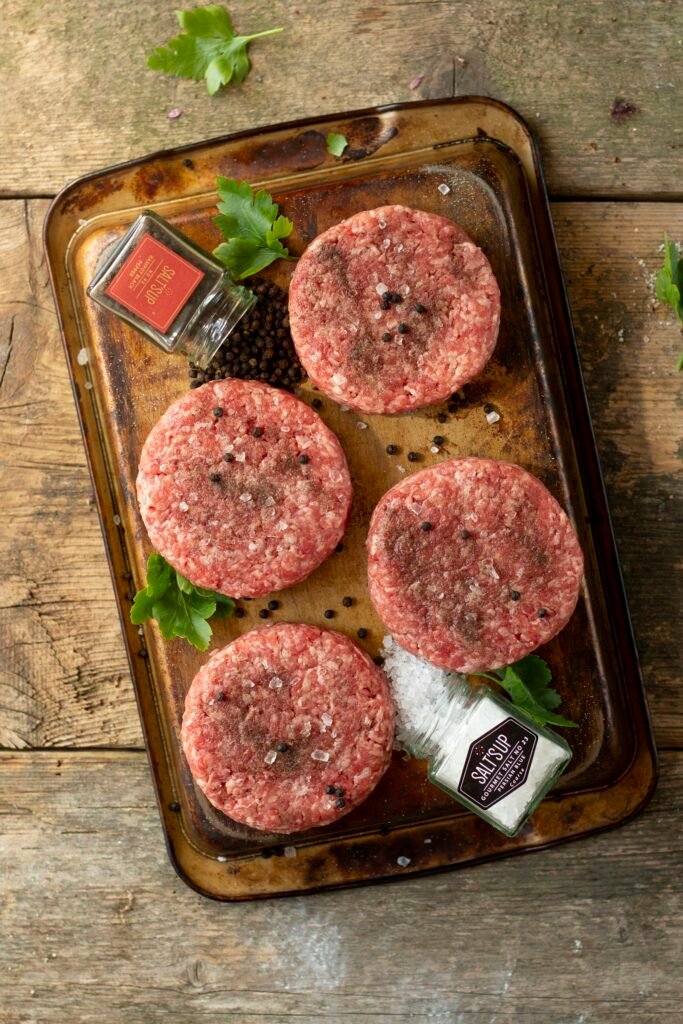 Raw minced beef burger patties